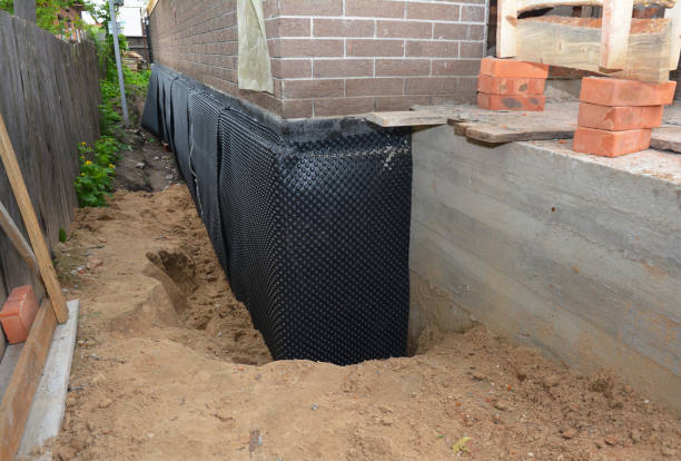 Happy homeowners after waterproofing job in Spring Hill